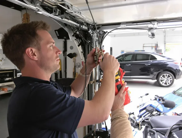 Stratford Garage Door Repair safety certified technician performing cable replacement in Stratford