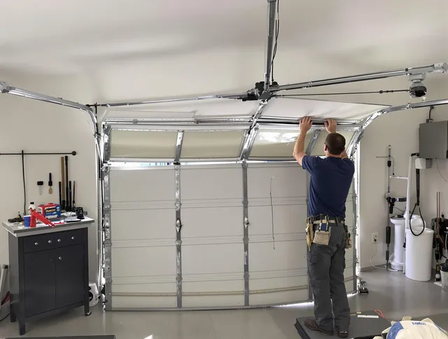 Stratford Garage Door Repair specialist performing precise section replacement on Stratford garage door